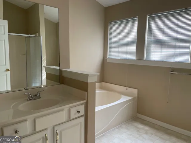 a bathroom with a sink and a bathtub