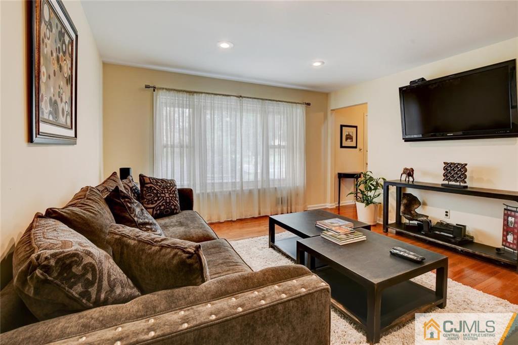 8 Vince Road Somerset, NJ 08873 - Photo 2 of 24 a living room with furniture and a flat screen tv