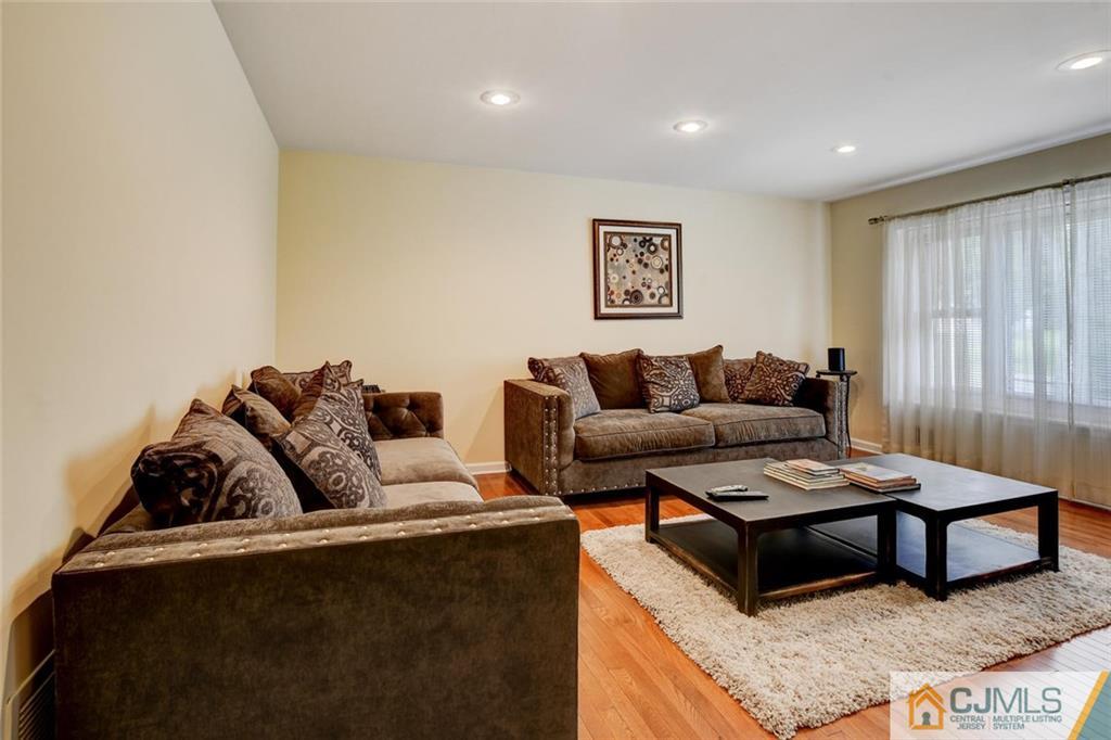 8 Vince Road Somerset, NJ 08873 - Photo 19 of 24 a living room with furniture and a couch