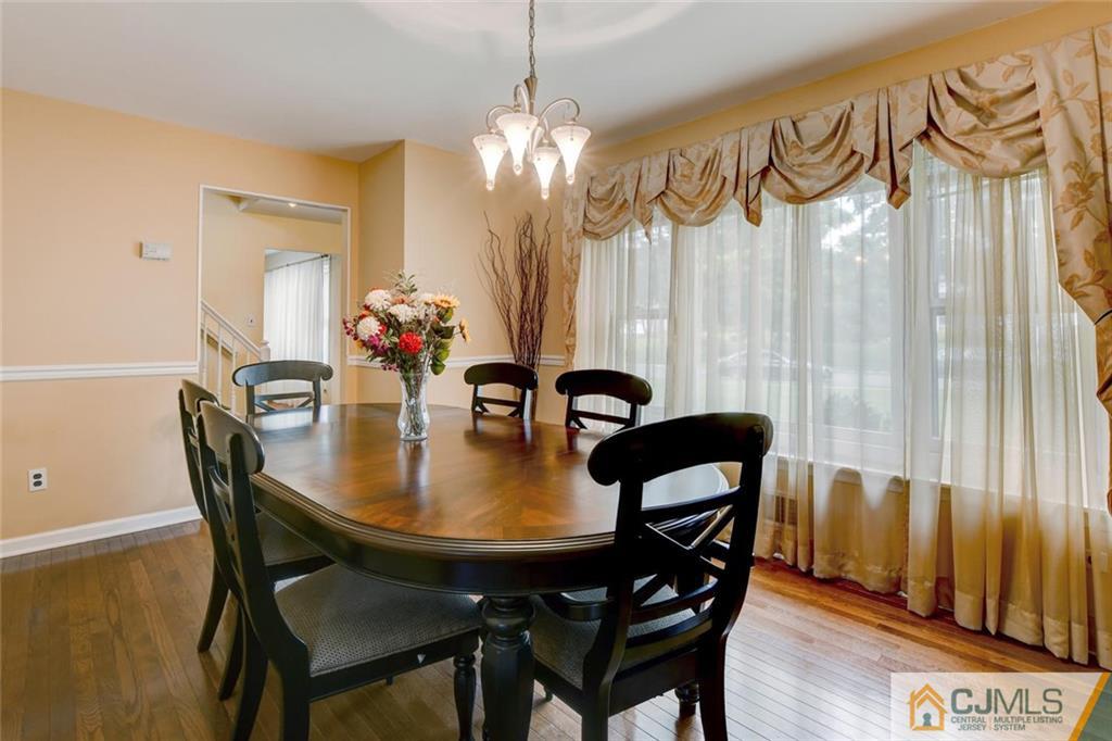 8 Vince Road Somerset, NJ 08873 - Photo 20 of 24 a view of a dining room with furniture and wooden floor