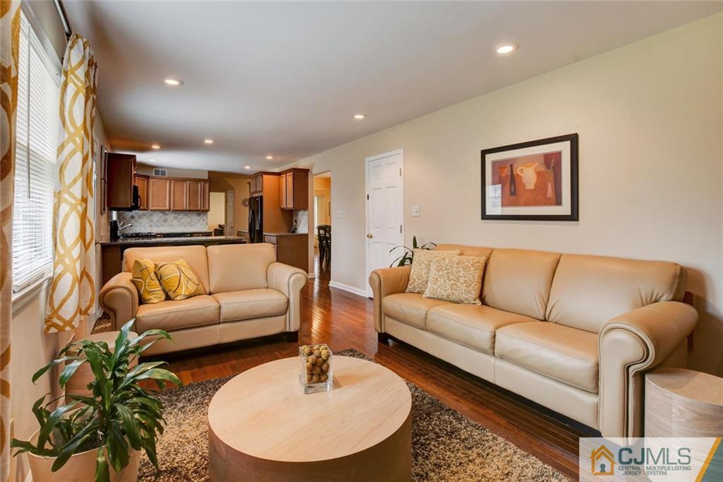 8 Vince Road Somerset, NJ 08873 - Photo 7 of 24 a living room with furniture and a wooden floor