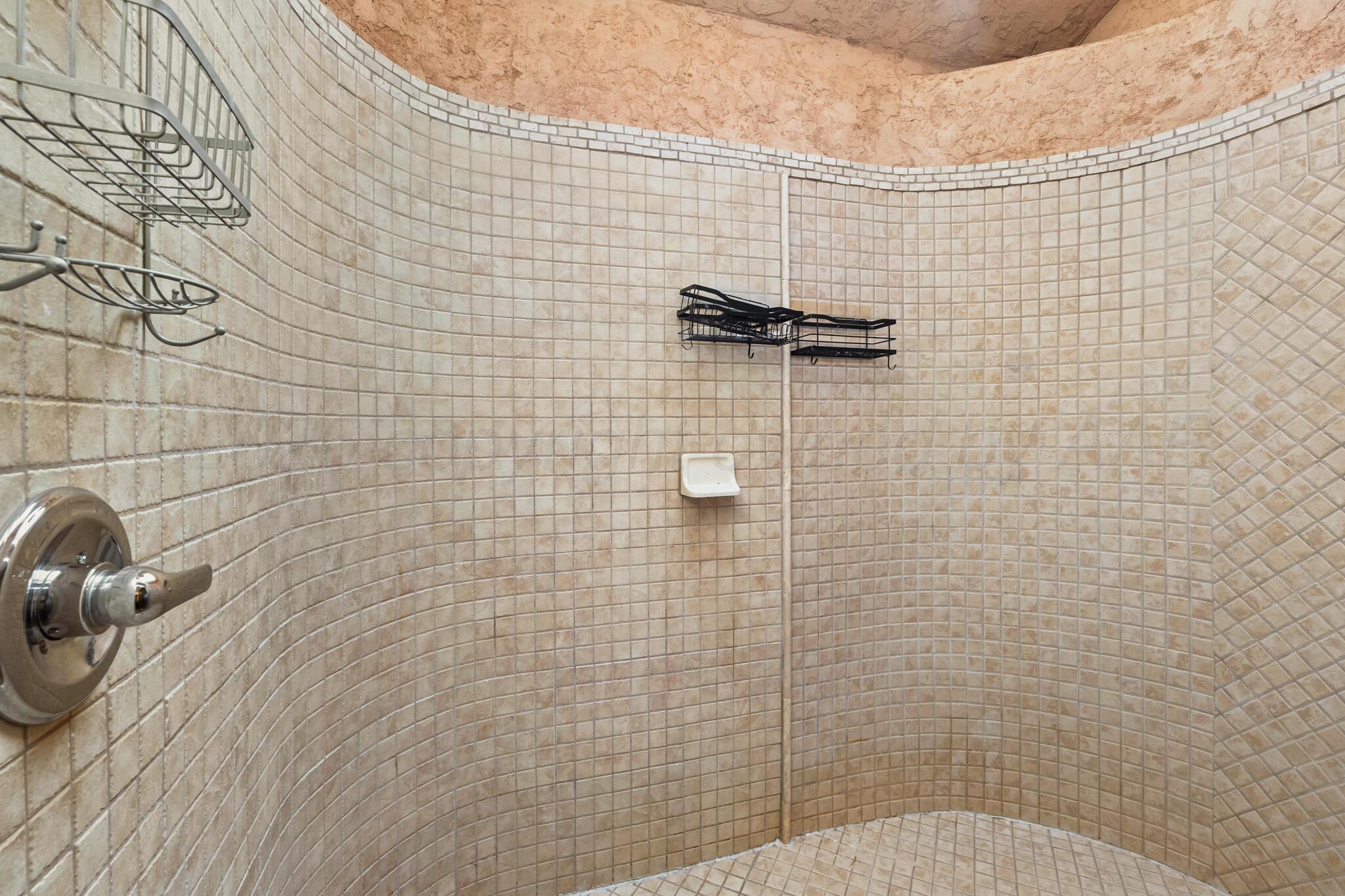 2217 Peach Tree Street Amarillo, TX 79109 - Photo 15 of 26 a bathroom with a shower