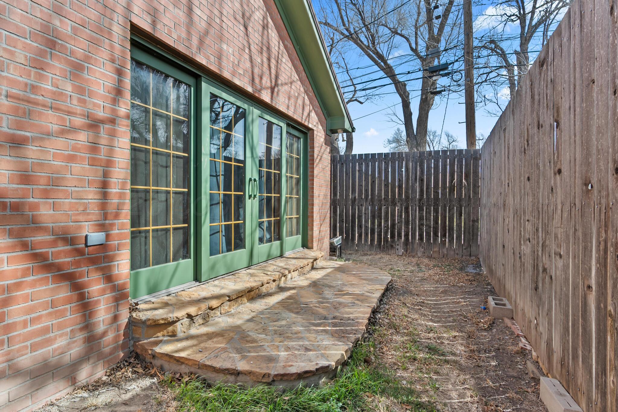 2217 Peach Tree Street Amarillo, TX 79109 - Photo 17 of 26 a view of a house with a small yard
