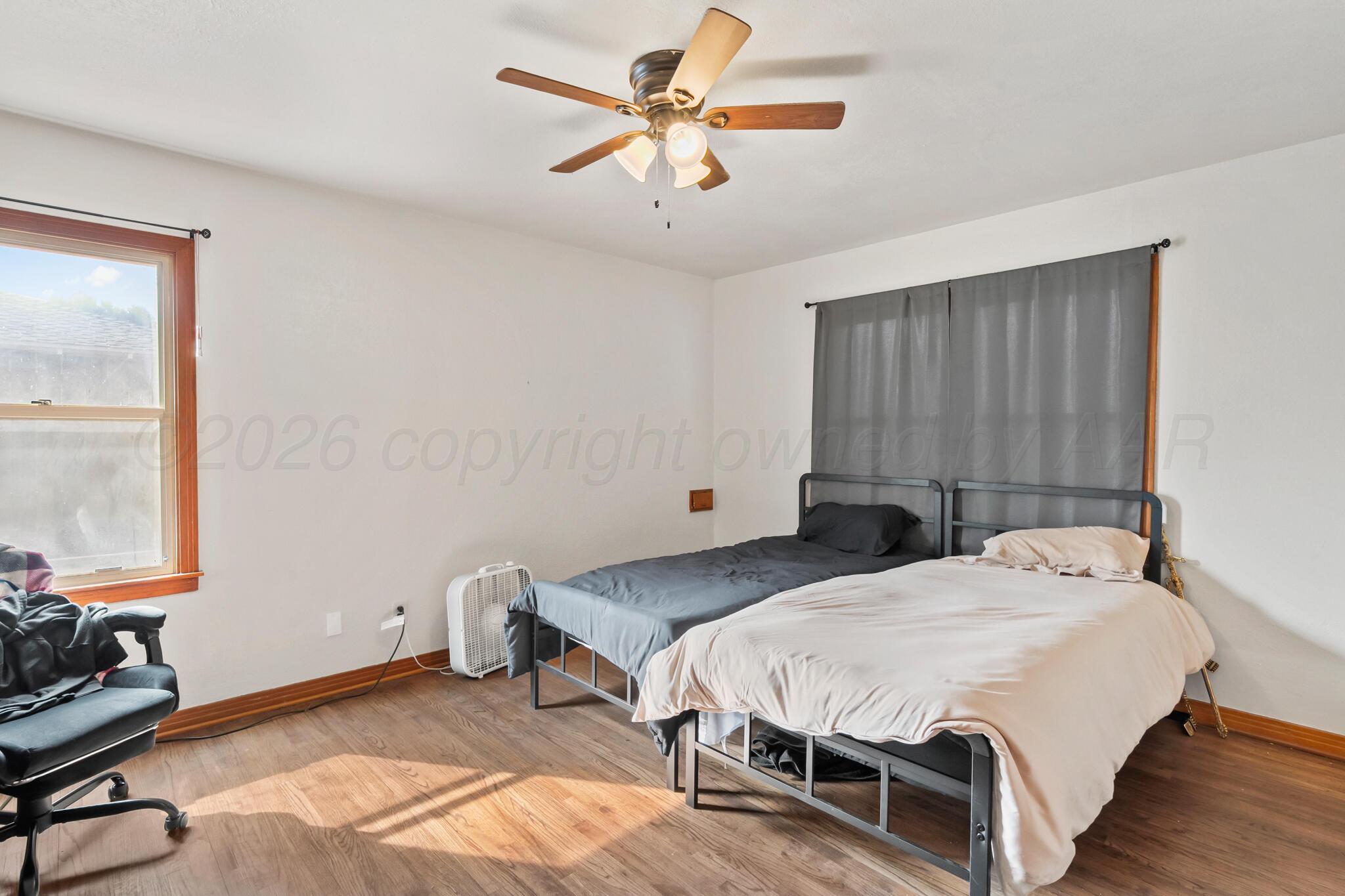 2217 Peach Tree Street Amarillo, TX 79109 - Photo 22 of 26 a bedroom with a bed and a window
