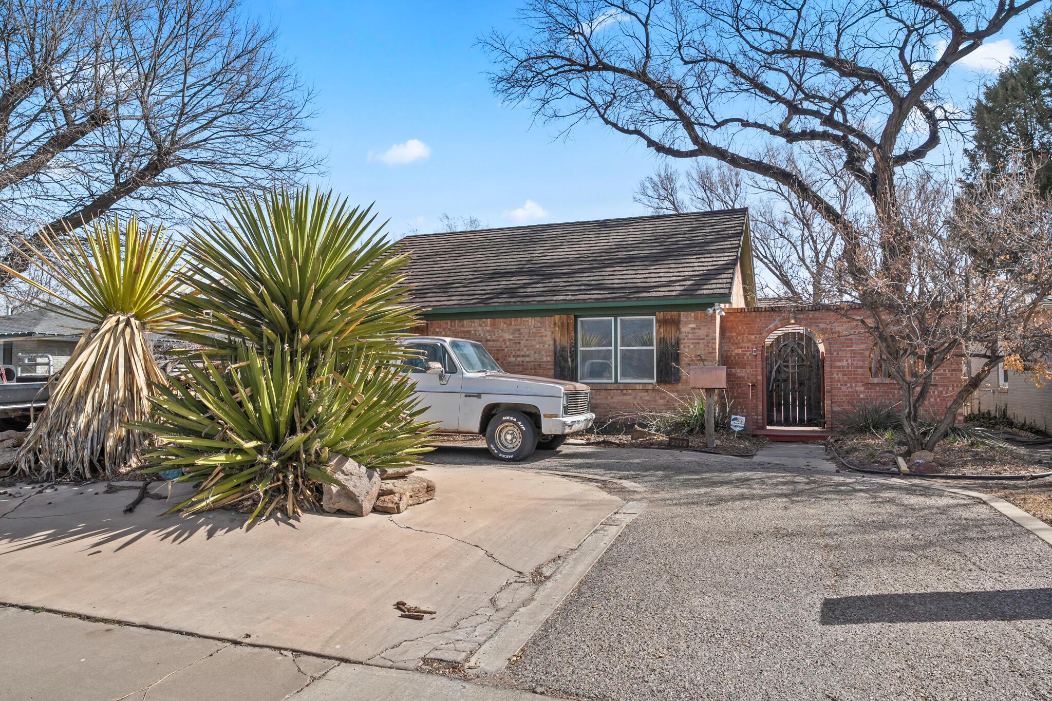 2217 Peach Tree Street Amarillo, TX 79109 - Photo 24 of 26 a view of a car parked in front of a house