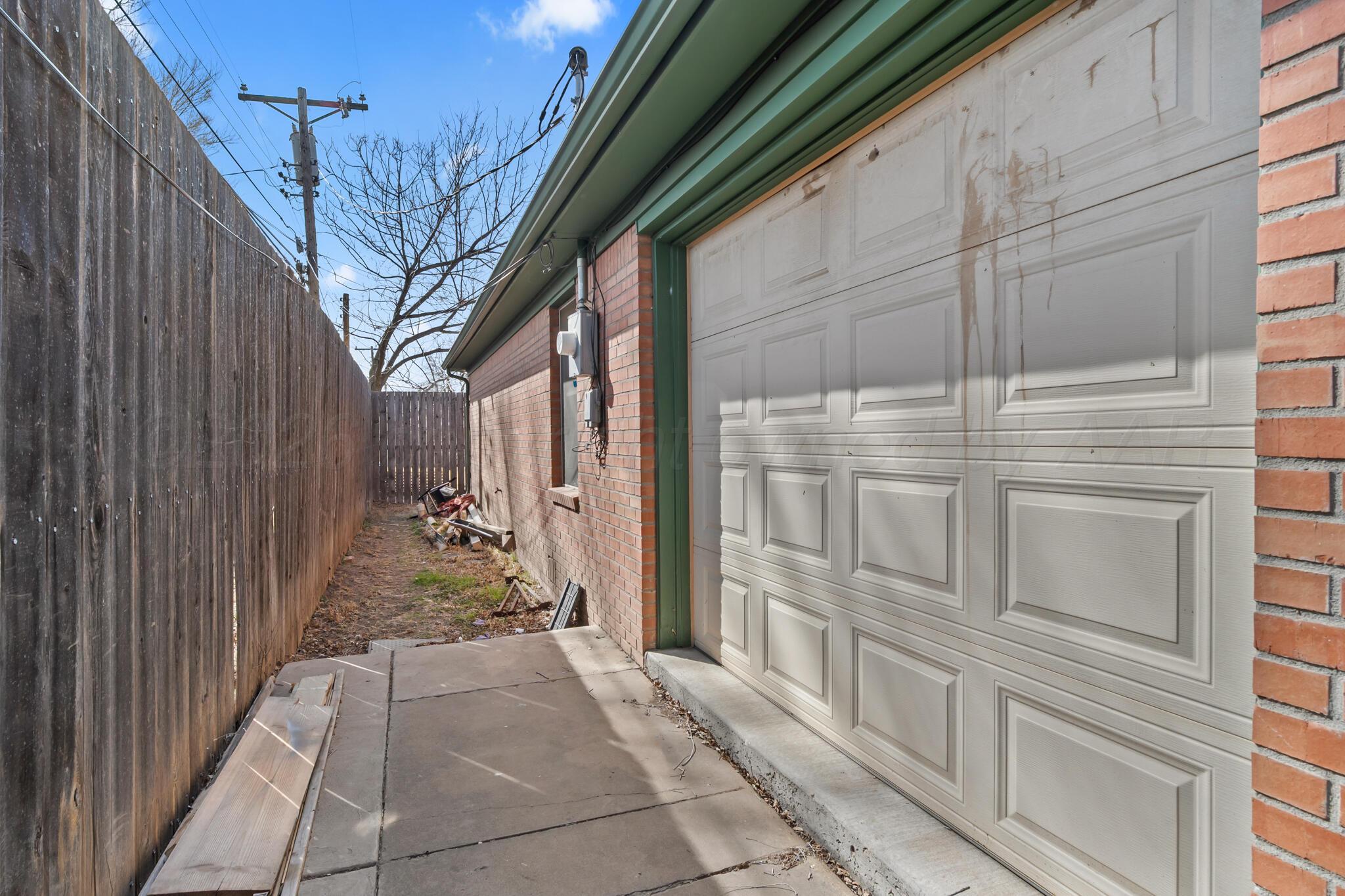 2217 Peach Tree Street Amarillo, TX 79109 - Photo 25 of 26 a view of a house with a pathway