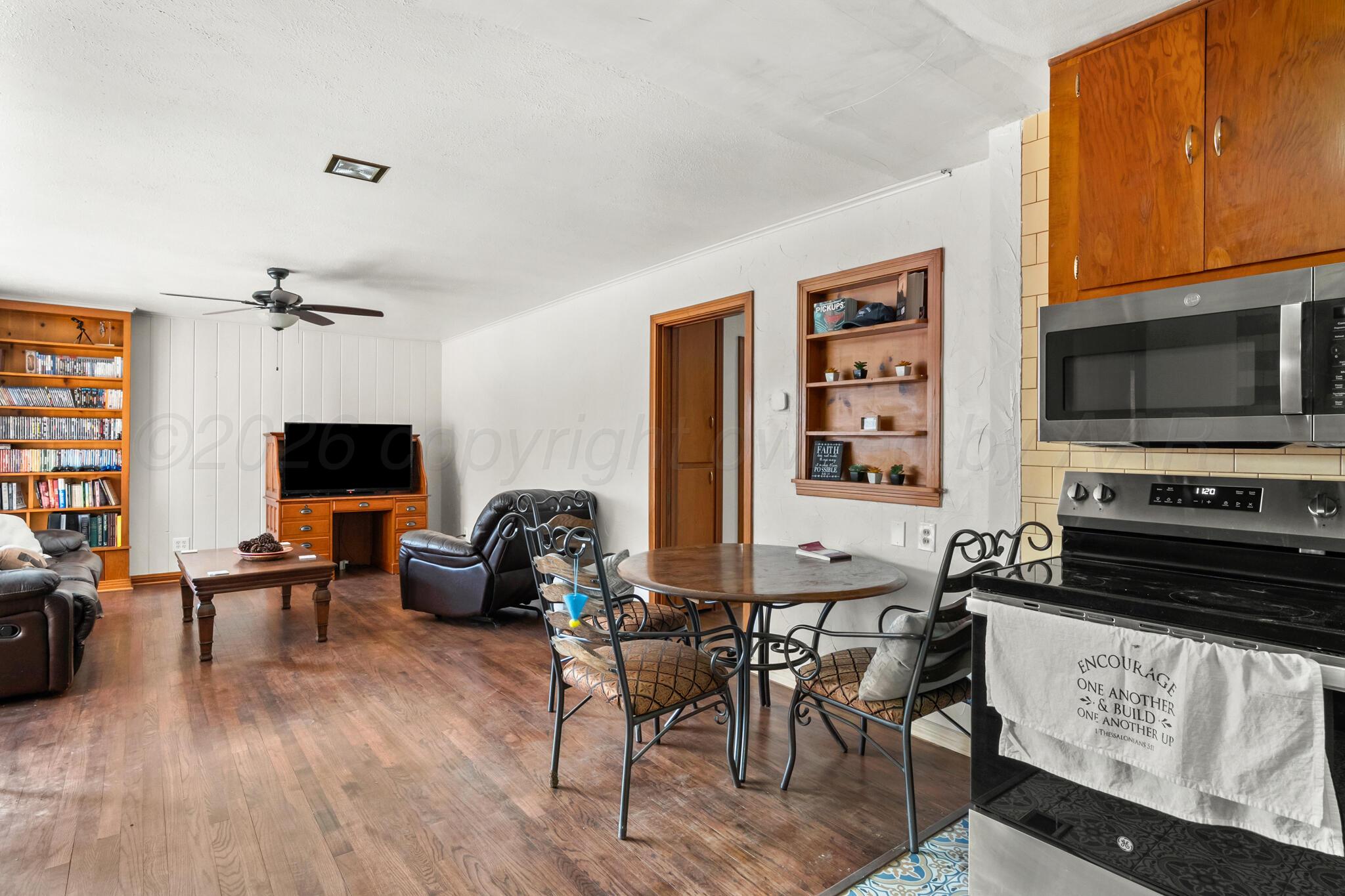 2217 Peach Tree Street Amarillo, TX 79109 - Photo 10 of 26 a living room with furniture and a flat screen tv