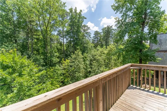 a view of a room with wooden floor and outdoor space