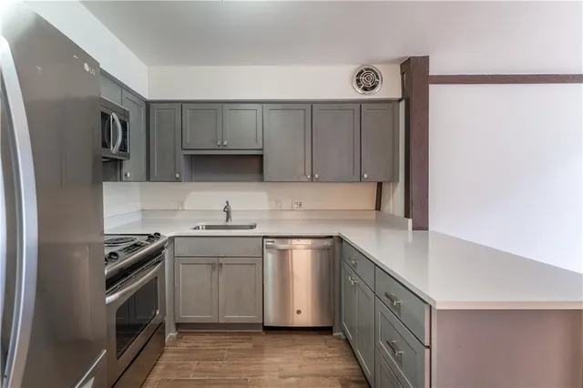 a bathroom with a sink a toilet and a bathtub