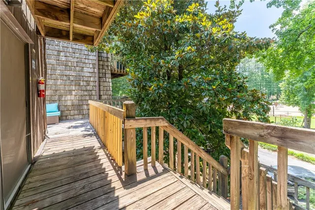 a view of an empty room with a ceiling fan