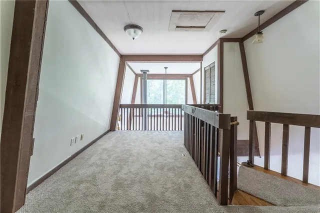 a view of a hallway with stairs