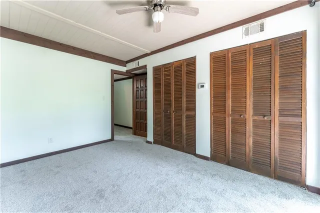 a balcony with trees in front of it