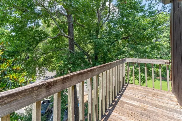 a view of a field with sitting area and garden