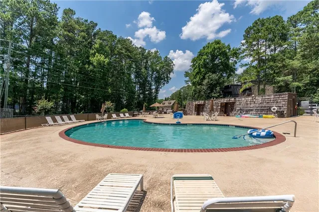 a view of a swimming pool with a sitting space