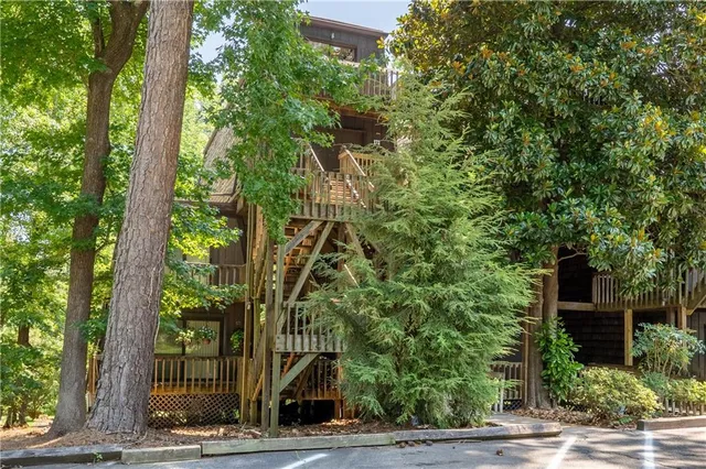 a view of a house with a tree