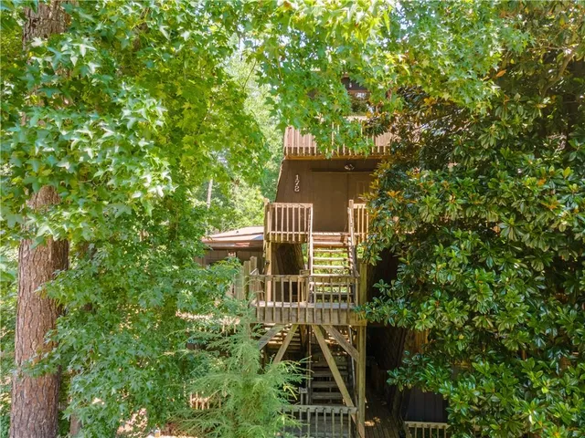 a view of a house with a tree