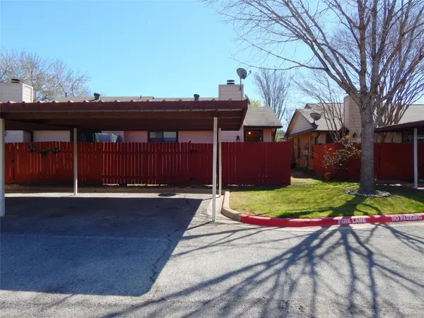 a view of a house with basketball court