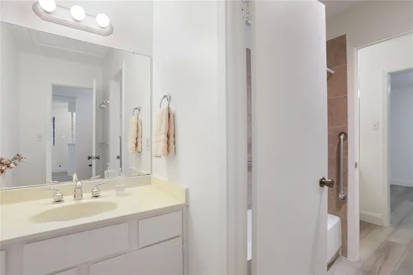 a bathroom with a double vanity sink and mirror