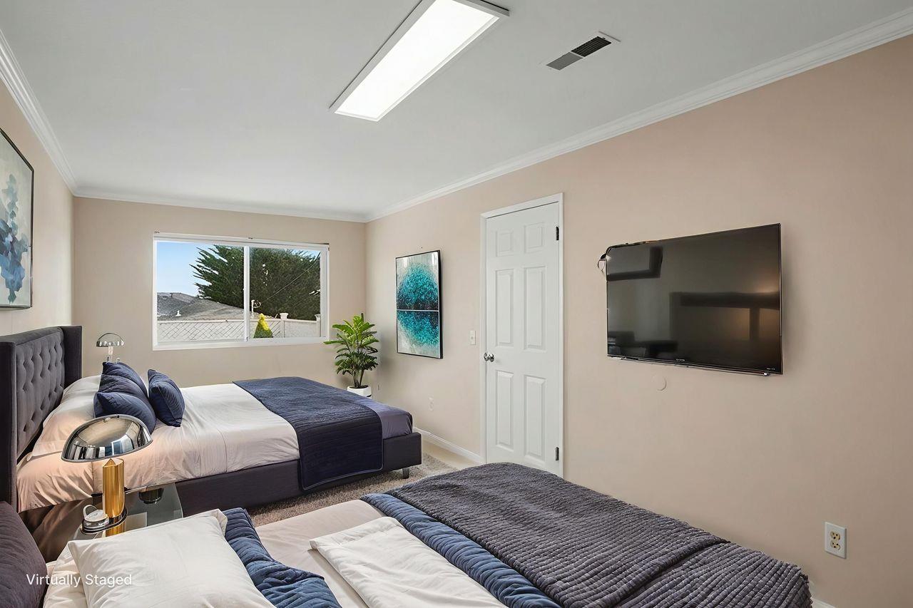 701 Archer Street Monterey, CA 93940 - Photo 19 of 39 a bedroom with a bed and a flat screen tv