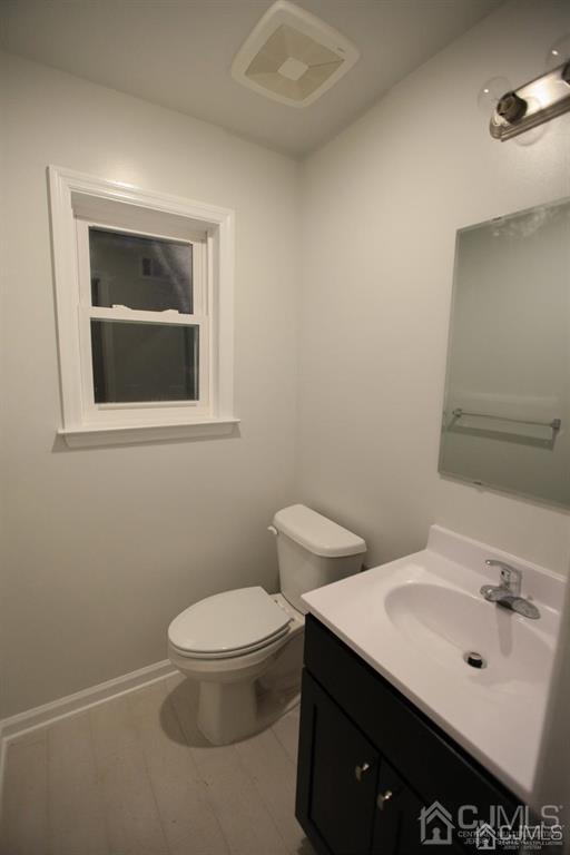 3301 Hana Road Edison, NJ 08817 - Photo 8 of 39 a bathroom with a sink a toilet and mirror