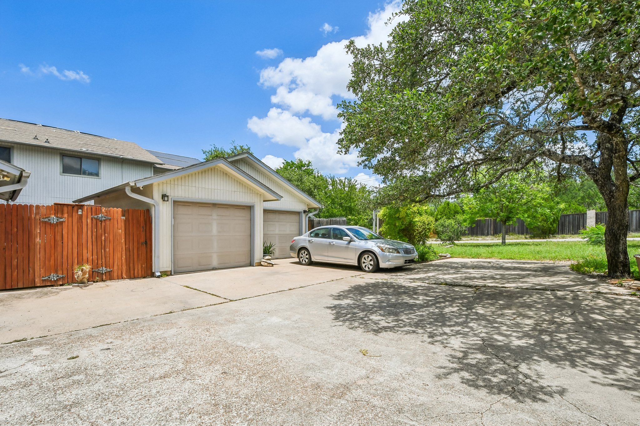 4202 Hudson Bend Road, Unit B Austin, TX 78734 - Photo 25 of 26 a view of a house with backyard and trees