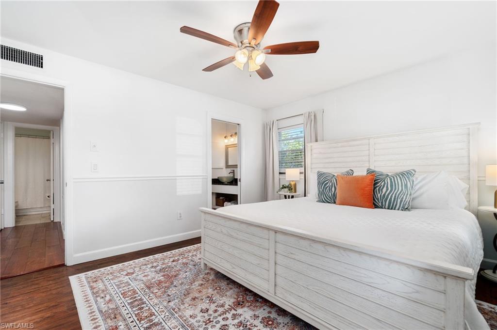 3543 Corana Way Naples, FL 34105 - Photo 14 of 26 a room with a bed and a rug