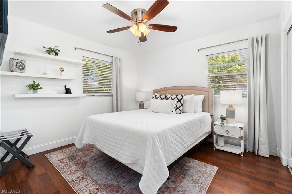 3543 Corana Way Naples, FL 34105 - Photo 18 of 26 a bedroom with a bed and a window