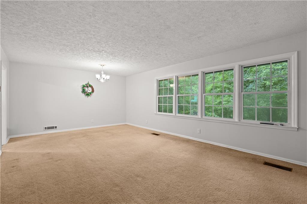 768 Burwell Road Carrollton, GA 30117 - Photo 12 of 42 an empty room with a window