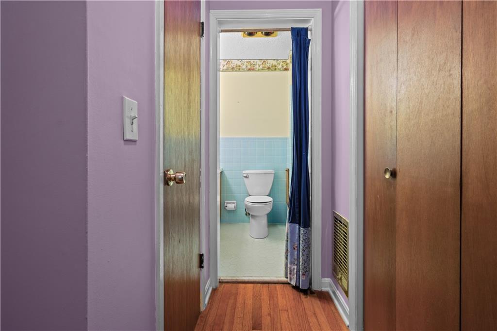 768 Burwell Road Carrollton, GA 30117 - Photo 19 of 42 a view of a bathroom with a toilet and a shower