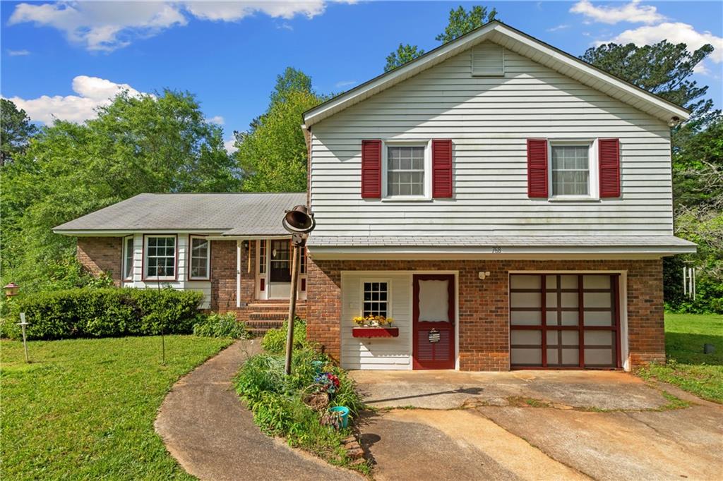 768 Burwell Road Carrollton, GA 30117 - Photo 3 of 42 a front view of a house with garden
