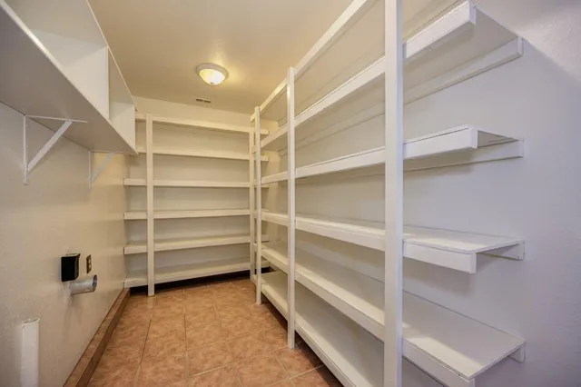 a view of an empty walk in closet