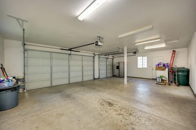 a view of a room with gym equipment and windows