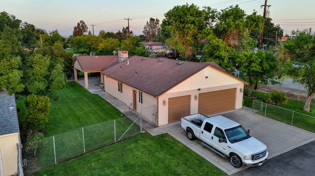 a swimming pool with outdoor seating and yard