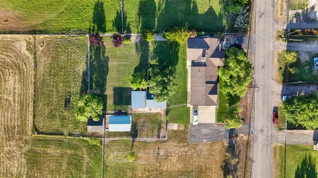 an aerial view of a house with a swimming pool