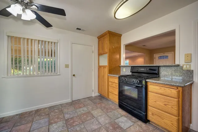 a kitchen with a stove and a sink