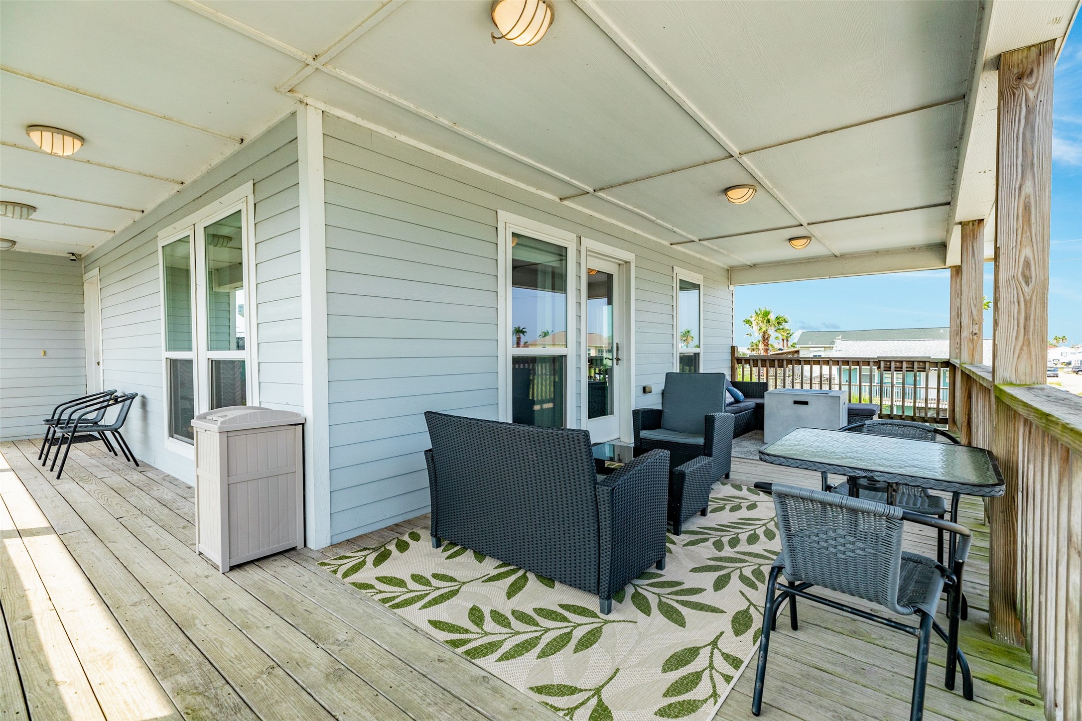 16547 Jolly Roger Road Jamaica Beach, TX 77554 - Photo 12 of 27 a living room with furniture and a table