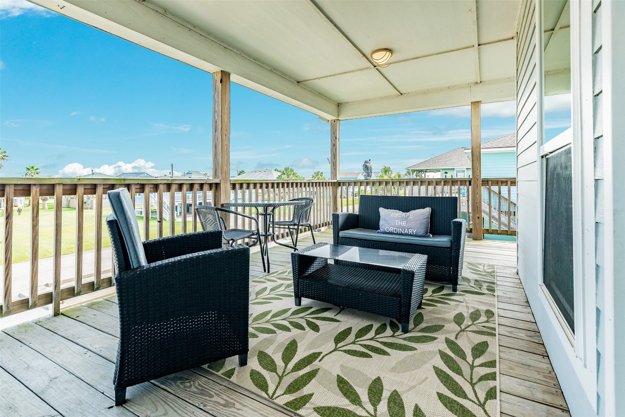 16547 Jolly Roger Road Jamaica Beach, TX 77554 - Photo 15 of 27 a balcony with wooden floor