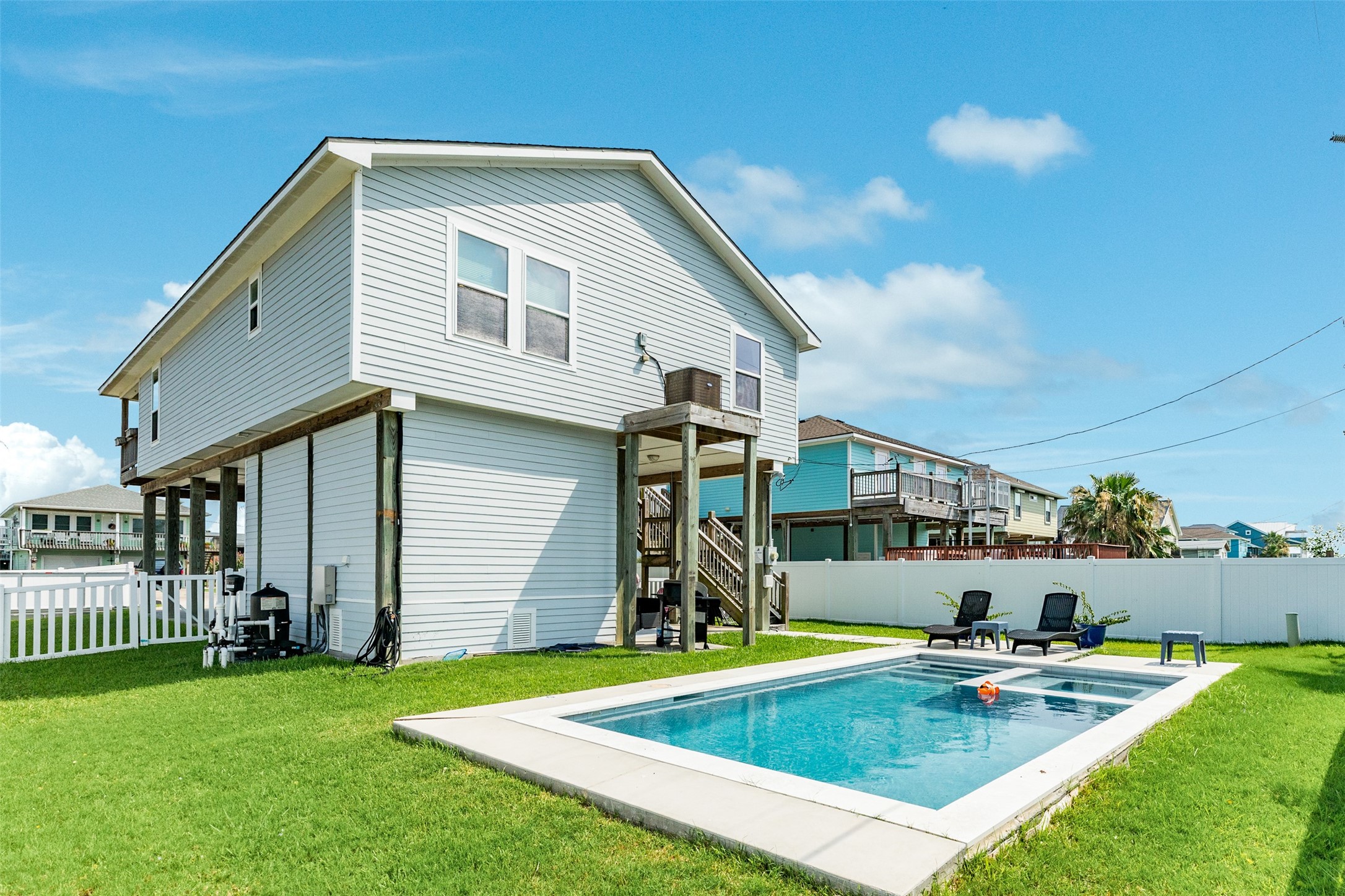 16547 Jolly Roger Road Jamaica Beach, TX 77554 - Photo 3 of 27 a view of a house with swimming pool and porch