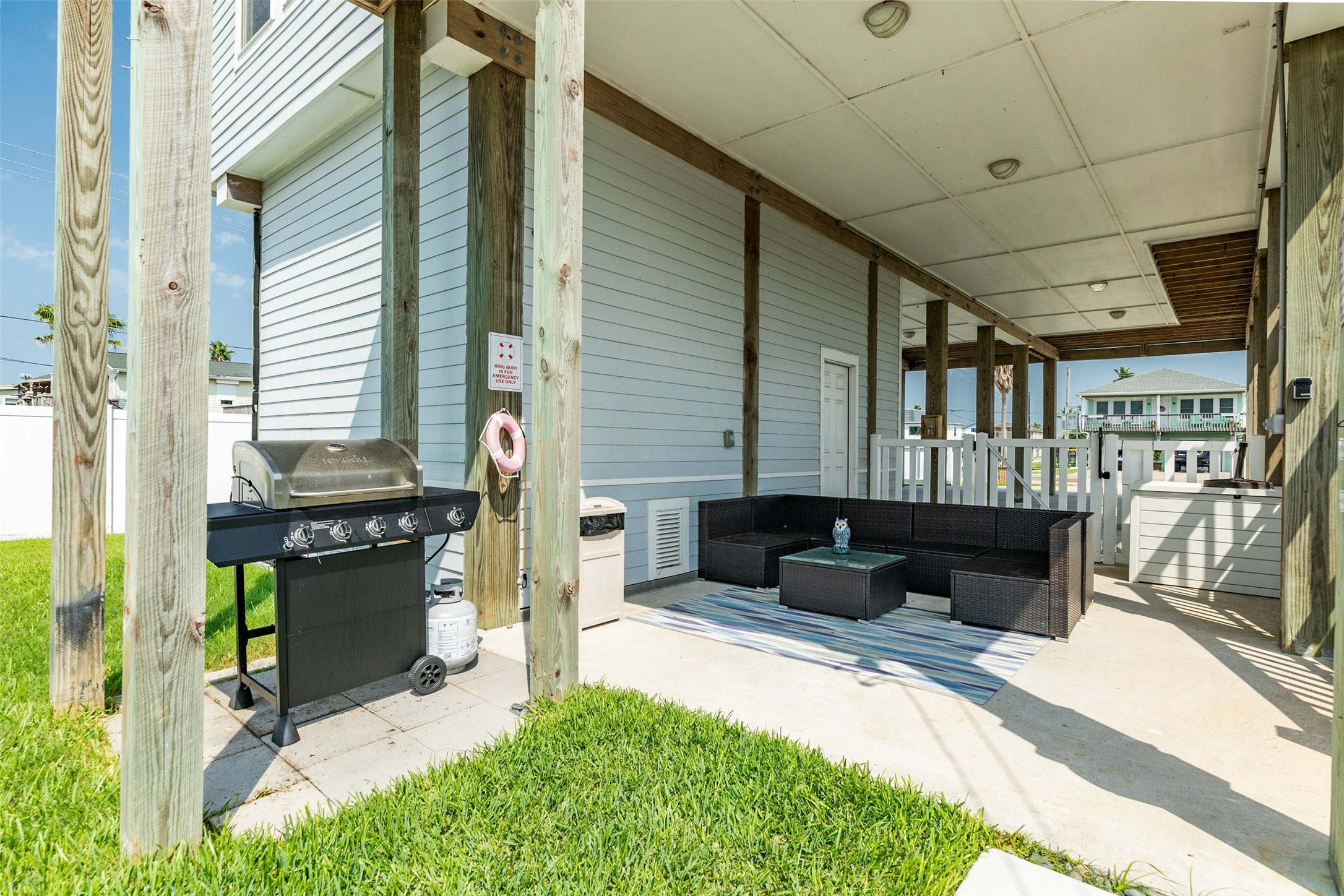 16547 Jolly Roger Road Jamaica Beach, TX 77554 - Photo 8 of 27 a living room filled with furniture and a fireplace