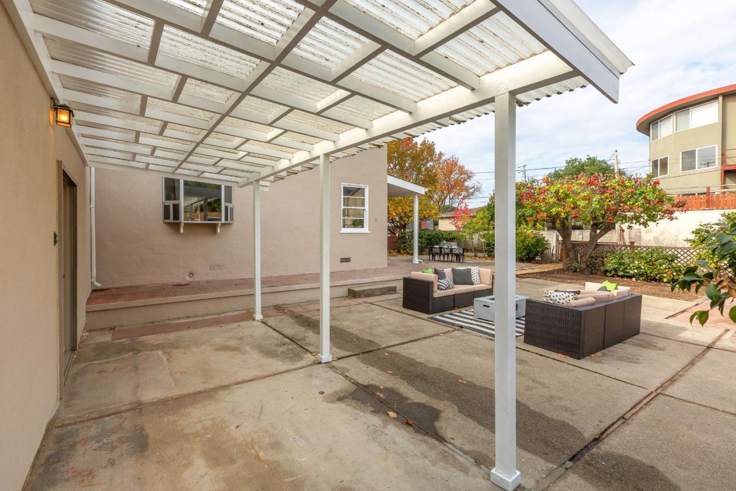 230 Victoria Road Burlingame, CA 94010 - Photo 44 of 69 a view of a porch with chairs and potted plants