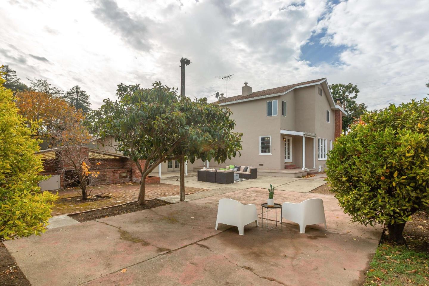 230 Victoria Road Burlingame, CA 94010 - Photo 46 of 69 a view of a patio with a table and chairs