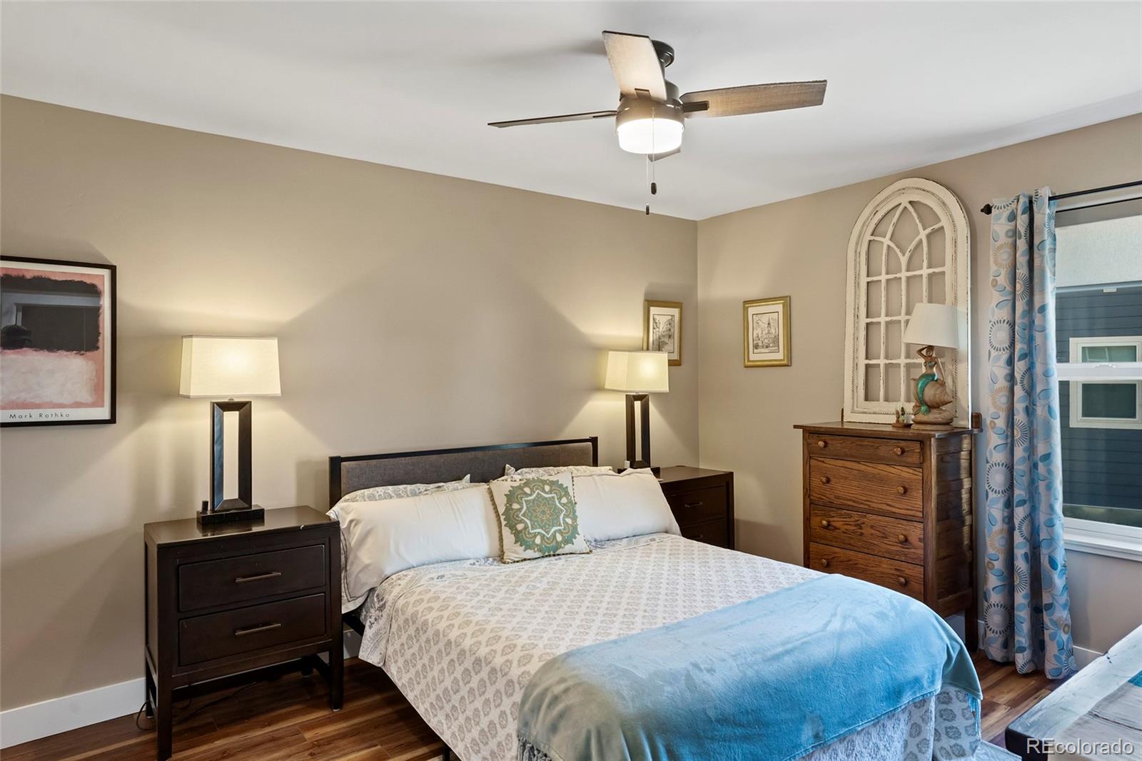 365 Lake View Road Hayden, CO 81639 - Photo 13 of 24 a bedroom with a bed and wooden floor