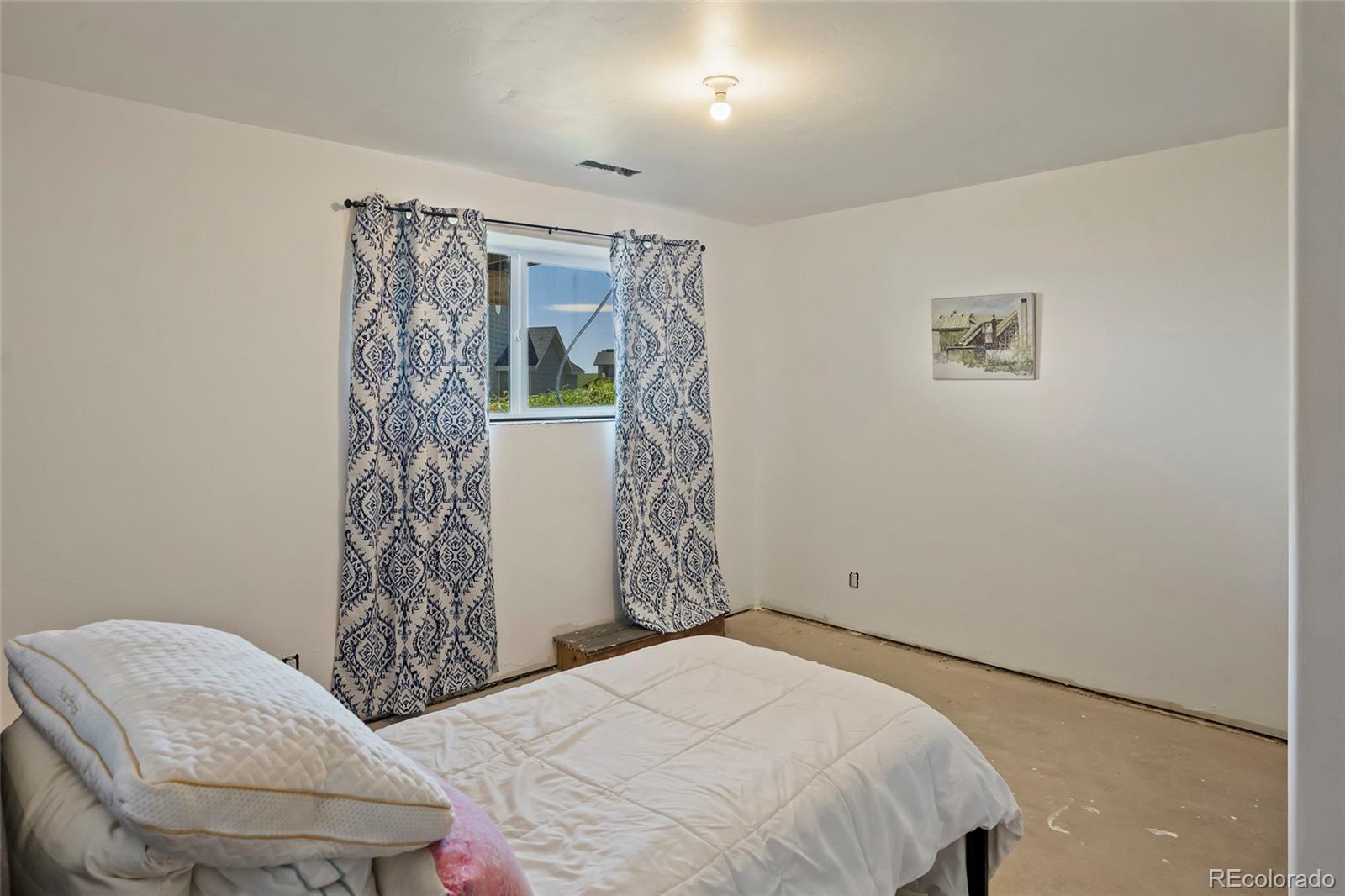 365 Lake View Road Hayden, CO 81639 - Photo 19 of 24 a bedroom with a bed and a window