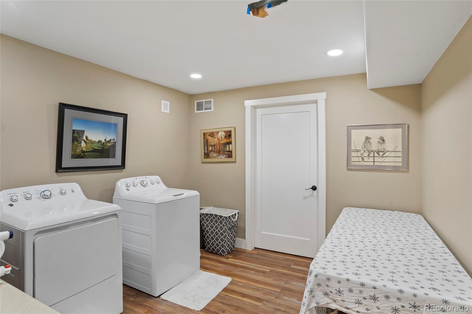 365 Lake View Road Hayden, CO 81639 - Photo 20 of 24 a bedroom with a bed and wooden floor