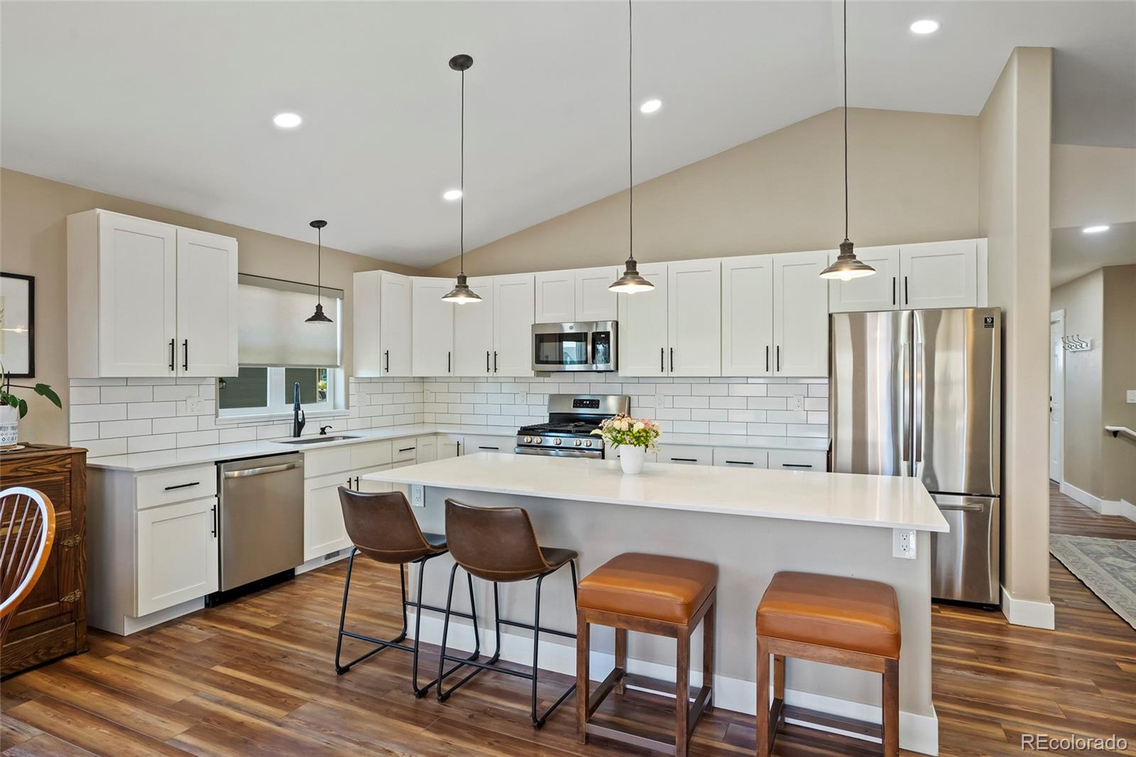 365 Lake View Road Hayden, CO 81639 - Photo 5 of 24 a kitchen with kitchen island granite countertop a sink a center island and stainless steel appliances