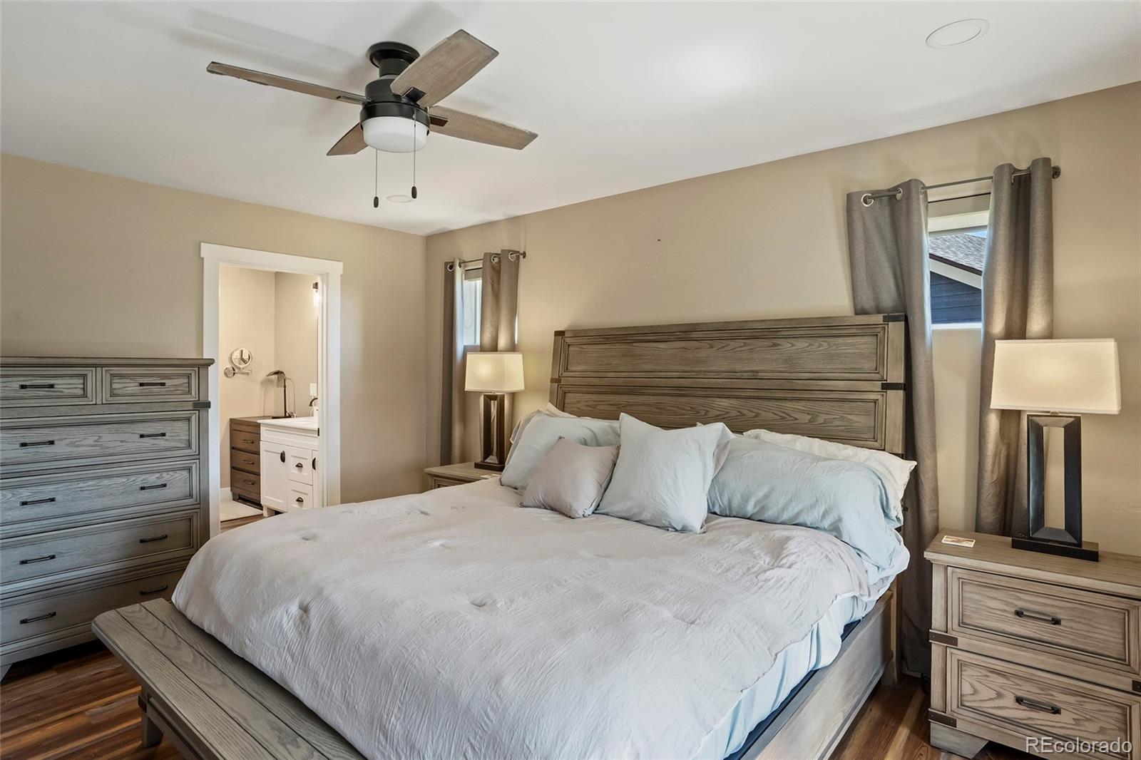 365 Lake View Road Hayden, CO 81639 - Photo 10 of 24 a bedroom with a bed and dresser with mirror