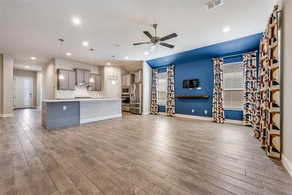 an empty room with windows and closet