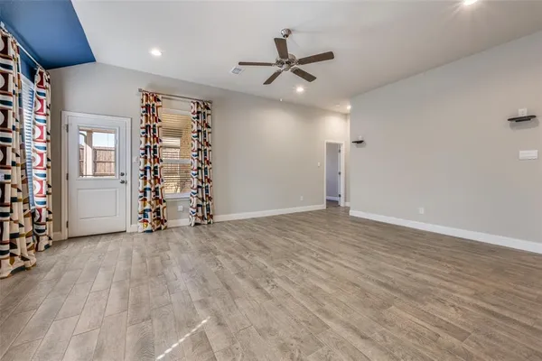 a view of a kitchen with a sink and a window