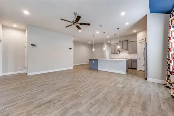 a view of kitchen and kitchen with furniture wooden floor and window