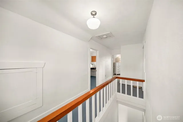 a view of staircase with white walls